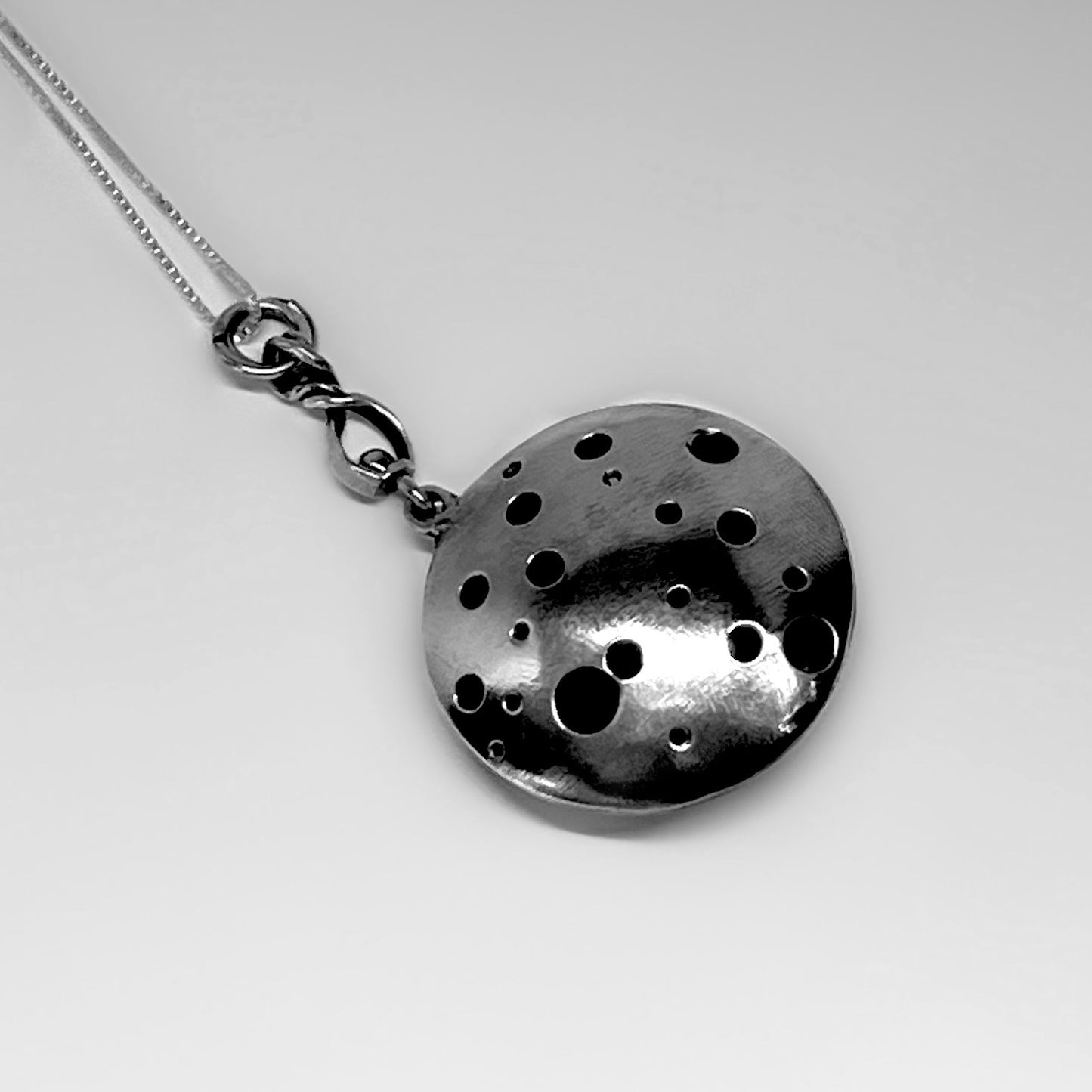 Hole-y Rotating Sterling Silver Necklace
